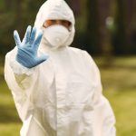 Person in a protective suit in a park